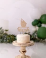 Topper na roczek z babeczką ze sklejki brzozowej na torcie. Drewniana ozdoba na tort w kształcie babeczki z napisem Roczek.