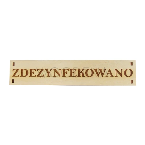 Drewniana tabliczka z napisem „Zdezynfekowano"