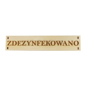 Drewniana tabliczka z napisem „Zdezynfekowano"