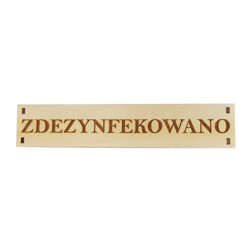 Drewniana tabliczka z napisem „Zdezynfekowano"